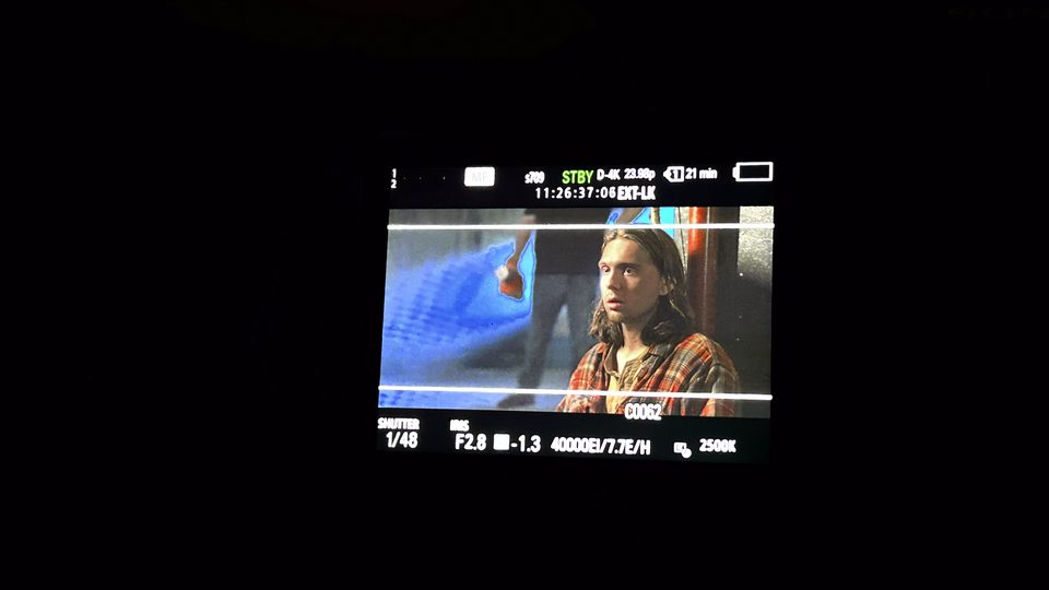 A director's monitor showing a framed shot during production.