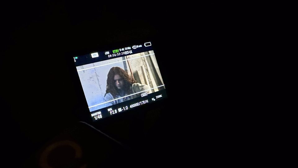 A second director's monitor mid-take.