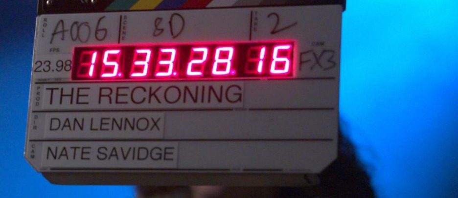 A production slate on set reading The Reckoning, Dan Lennox, Nate Savidge.